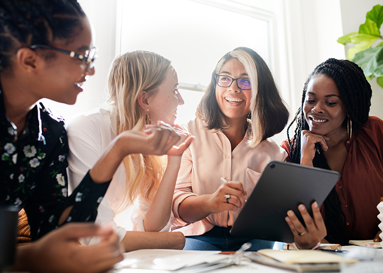 Diverse group of young business women talking